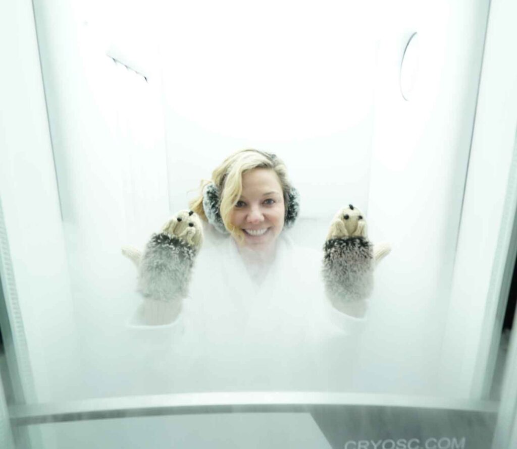 a woman in a cryo therapy chamber